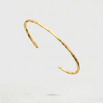 Gold Cuff Bracelet on a white background